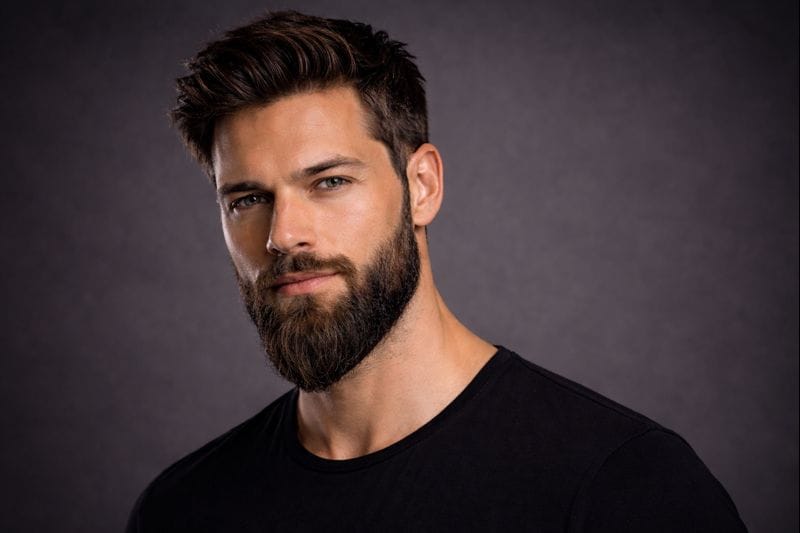 Man wearing a ducktail beard style with a tapered point at the chin.